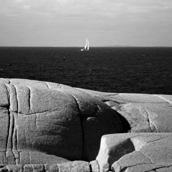 Black and white digital photograph. A Sailboat at High Head Trail in Nova Scotia.  Available framed or unframed 12 inch image.