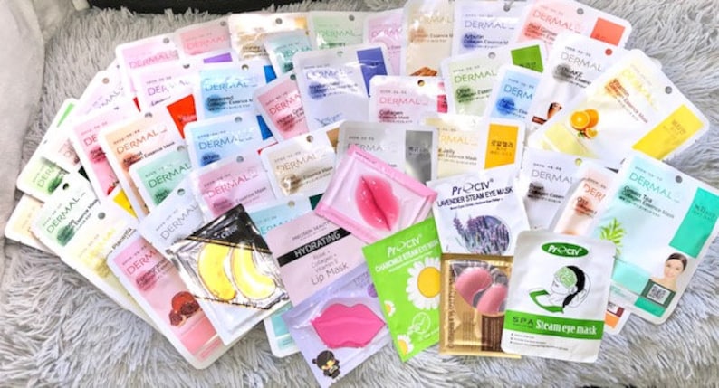 May include: A selection of face and eye masks in a range of colours and designs. The masks are individually packaged in pouches and feature different ingredients and benefits. Some of the masks include 'Dermal' and 'Pro-ctiv' branding.