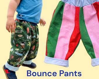 May include: Bounce Pants Sewing Pattern. A pair of pants with a dark green fabric featuring various insect illustrations and a second pair of pants with vertical stripes in green, pink, and red, both featuring light blue waistbands and cuffs.