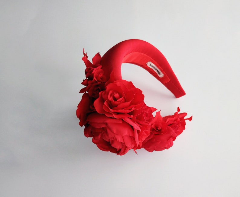 Red fascinator headband for wedding gues tin Kate Middleton style. Rose crown is hand made. Padded headband trimmed with flowers. Rose crown is a fabulous floral headpiece. Perfect as a alternative to a headpiece for wedding guests.