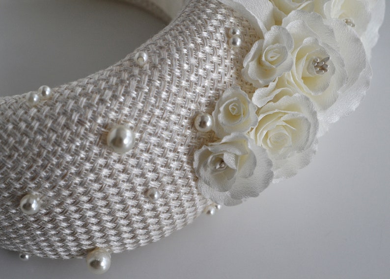 Bridal headband with pearls.  Bridal flower crown has been covered in ivory fabric. Halo crown headband has been trimmed with flowers. Modern and elegant wedding fascinator will instantly elevate any outfit.One size. Width - 7 cm, height of 4-4,5 cm