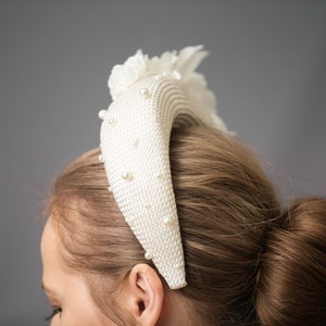 Bridal headband with pearls inspired by Kate Middleton.  Bridal flower crown  comes with faux pearls. 
Bridal hairband has been trimmed with flowers Wedding fascinator will instantly elevate any outfit.
This silk flower crown is unique work.