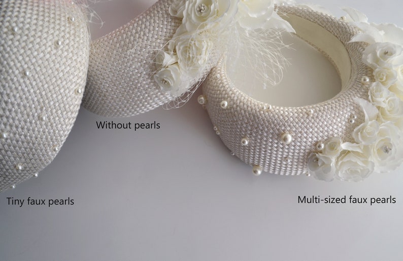 This bridal flower crown features a floral headpiece. Cream wedding fascinator headband with birdcage veil inspired by Kate Middleton headband hat. Perfect as alternative to a traditional bridal hairband. Padded headband is finished with ivory fabric