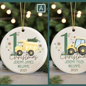 May include: Round Christmas ornament with a yellow dump truck and the text "1st Christmas" and the name "Jeremy James Williams 2025". The ornament has a gold string for hanging.