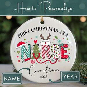 May include: A white ceramic Christmas ornament with the text "First Christmas as a Nurse." The word "Nurse" is decorated with medical and holiday-themed graphics. The ornament includes space for personalization with a name and the year 2025.