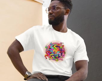 May include: A white t-shirt with a colorful graphic design of a sun with a swirling pattern. The sun is surrounded by a red and orange halo.