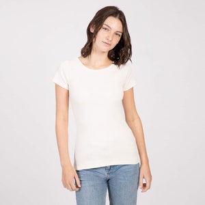 May include: A white short-sleeved t-shirt with a round neckline.
