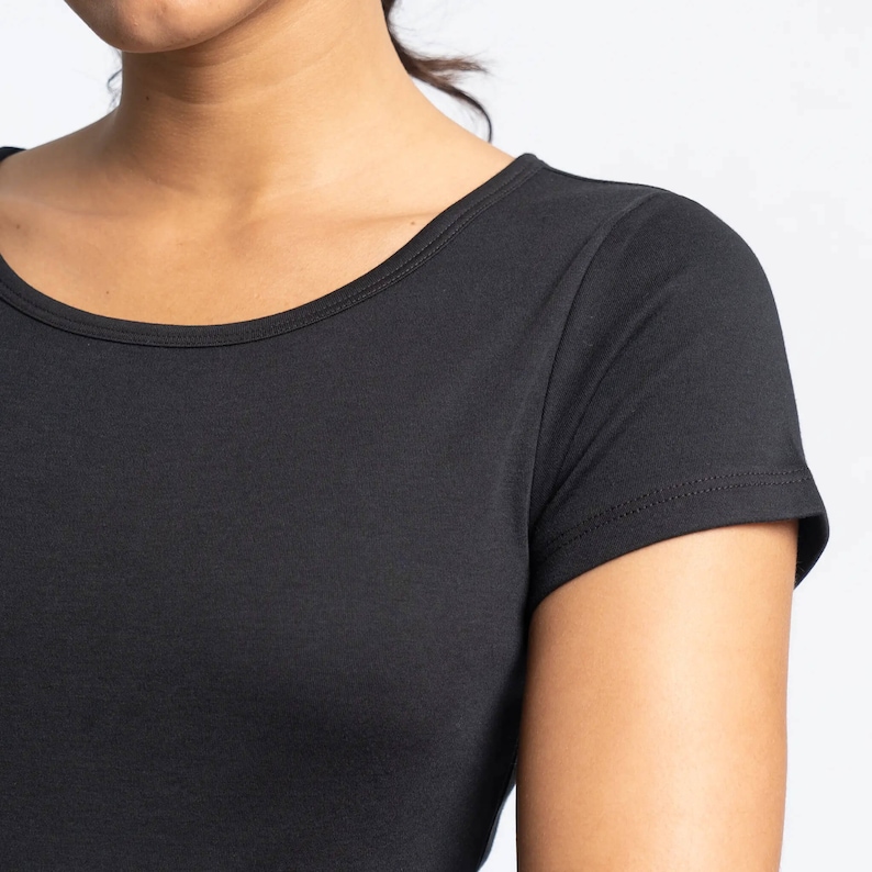 May include: A black short-sleeved t-shirt with a round neckline.