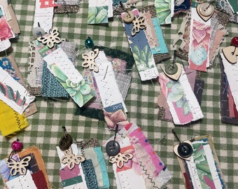 Fabric and paper embellishments on bulb pin ephemera