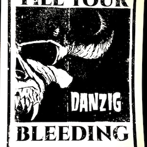 May include: Black and white poster with the text "TILL YOUR BLEEDING" and the name "DANZIG". The poster features a stylized illustration of a horned skull with sharp teeth.