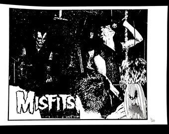 May include: Black and white print featuring the band Misfits. The image shows a concert scene with figures in the crowd and on stage. The band's name is prominently displayed in a stylized font. The print is numbered 1/20.