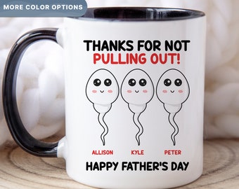 May include: White ceramic mug with a black interior and handle. The mug features the text "THANKS FOR NOT PULLING OUT!" above three cartoon sperm characters. Below the sperm are the names "ALLISON", "KYLE", and "PETER", with "HAPPY FATHER'S DAY" at the bottom.