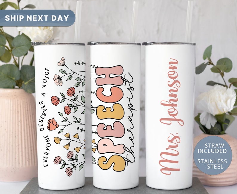 May include: Three stainless steel tumblers with a white background. The first tumbler has a floral design and the text "EVERYONE DESERVES A VOICE". The second tumbler has the text "SPEECH therapist" in a colourful, retro font. The third tumbler has the text "Mrs. Johnson" in a pink font.