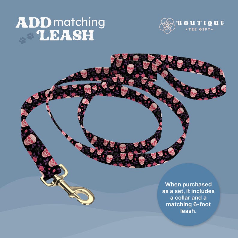May include: A black dog leash with a repeating pattern of pink skulls and roses. The leash has a gold-colored metal clasp. Text on the image reads "ADD matching LEASH" and "BOUTIQUE TEE GIFT."