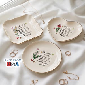 May include: Three cream-colored ceramic trinket dishes with gold-trimmed edges, featuring floral illustrations, butterflies, and the text "Chapter Seventy" with personalized names Christine, Nicole, and Laura, plus birthday wishes and sentimental quotes.