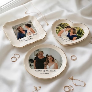 May include: A set of three ceramic mugs with a speckled, matte finish. The mugs are in shades of cream, light gray, and dark gray. Each mug has a simple, minimalist design, perfect for coffee or tea.