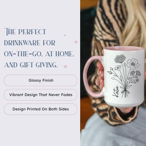 May include: White ceramic mug with a pink rim and a black line drawing of flowers and the name "Katie".