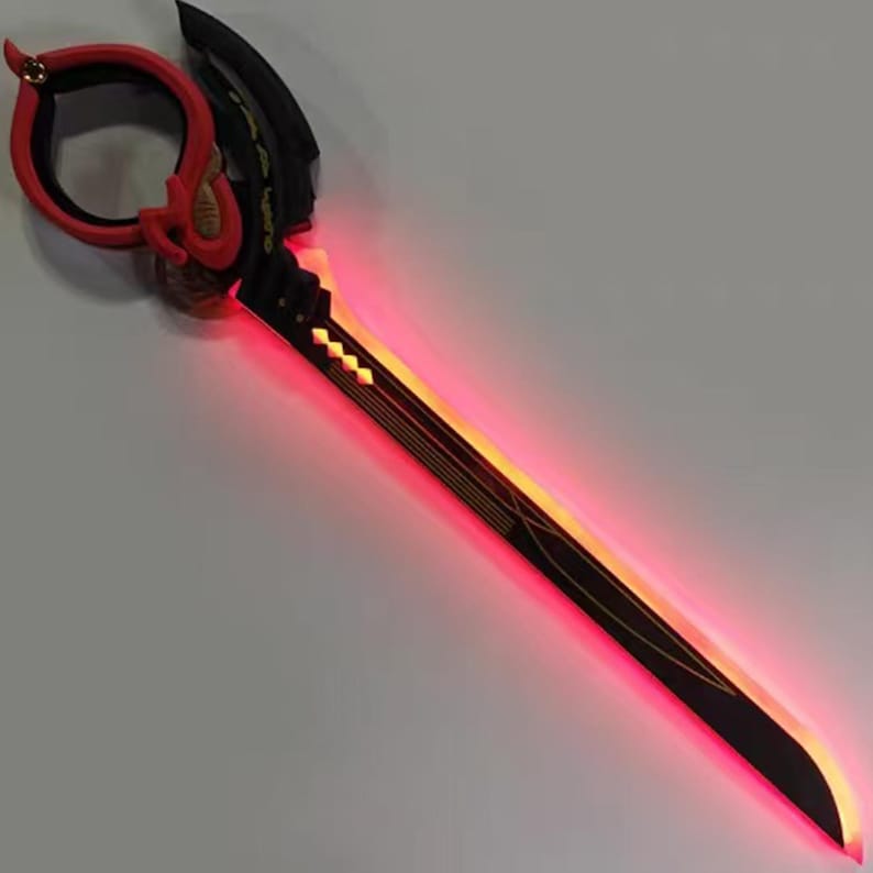 May include: A black and red sword with a glowing red blade and gold accents. The handle features a red loop and intricate detailing. The sword has a futuristic design, with a sleek, angular shape.