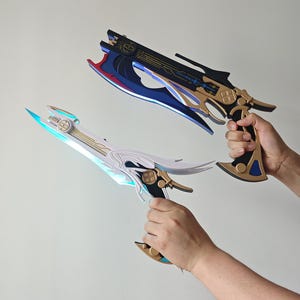 May include: Two stylized fantasy pistol-blade hybrid weapons. One weapon features a black frame with gold accents and blue blade detailing. The second weapon features a white frame with gold accents and light blue blade detailing. Both have intricate mechanical designs.