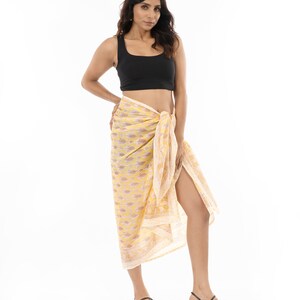 Light yellow organic cotton sarong. Hand block printed using azo free pigments in a delicate yellow floral print. Light and soft organic cotton voile. Beach Dress. Summer dress. Scarf.