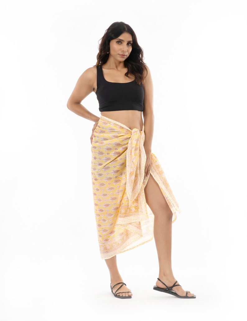 Light yellow organic cotton sarong. Hand block printed using azo free pigments in a delicate yellow floral print. Light and soft organic cotton voile. Beach Dress. Summer dress. Scarf.