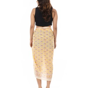 Light yellow organic cotton sarong. Hand block printed using azo free pigments in a delicate yellow floral print. Light and soft organic cotton voile. Beach Dress. Summer dress. Scarf.