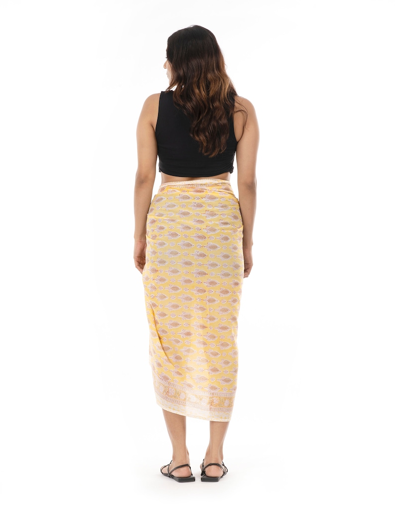 Light yellow organic cotton sarong. Hand block printed using azo free pigments in a delicate yellow floral print. Light and soft organic cotton voile. Beach Dress. Summer dress. Scarf.