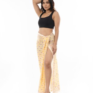 Light yellow organic cotton sarong. Hand block printed using azo free pigments in a delicate yellow floral print. Light and soft organic cotton voile. Beach Dress. Summer dress. Scarf.