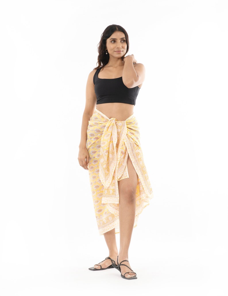 Light yellow organic cotton sarong. Hand block printed using azo free pigments in a delicate yellow floral print. Light and soft organic cotton voile. Beach Dress. Summer dress. Scarf.