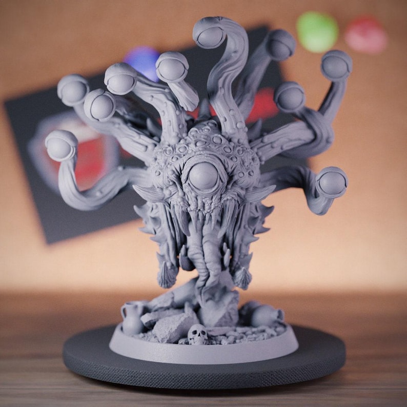 Unpainted 3D-printed fantasy beholder miniature, featuring a central eye and multiple eye stalks with intricate detailing. The creature hovers menacingly above a rocky base adorned with skulls, showcasing its fearsome nature. Crafted in high-end UV-cured resin, this model offers exceptional durability and fine detail, perfect for Dungeons & Dragons campaigns. Ideal for painters and collectors seeking a high-quality addition to their tabletop miniatures.