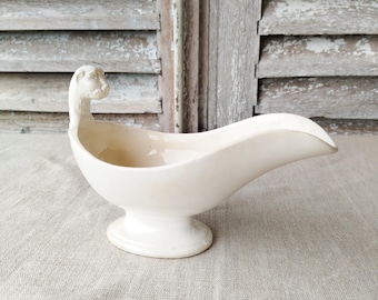 Antique tiger head sauceboat, in antique white earthenware, French tableware, antique French tableware. David Johnston.