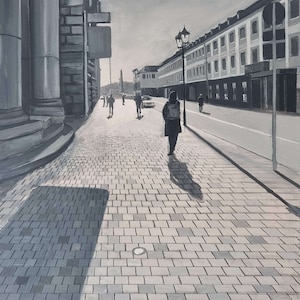 May include: Black and white painting of a city street scene. A person walks down a brick-paved sidewalk, with buildings and streetlights lining the road. The sun shines brightly in the sky, casting shadows.