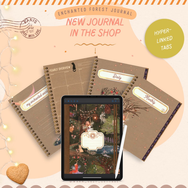 May include: Three brown spiral bound journals with gold rings. The covers feature a whimsical forest scene with fairies and lights. The journals are labeled "Yearly Overview", "Daily", and "Monthly". The text "ENCHANTED FOREST JOURNAL" and "NEW JOURNAL IN THE SHOP" is displayed above the journals. The text "HYPER-LINKED TABS" is displayed in a circle to the right of the journals.