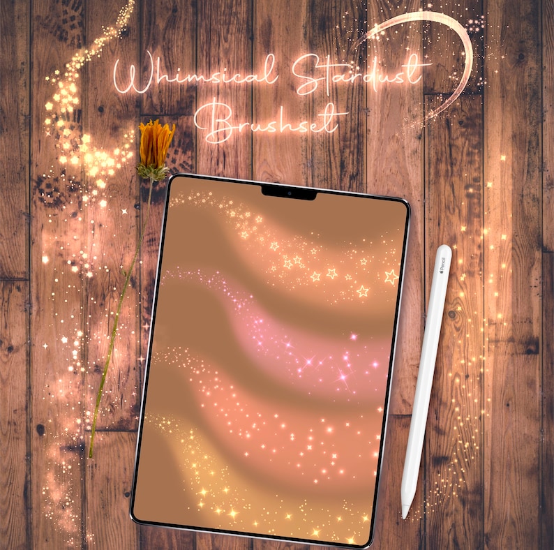 May include: A digital tablet displaying a design of sparkling stars and trails of light on a brown background. The text "Whimsical Stardust Brushset" is displayed above the tablet. A white stylus is lying next to the tablet.