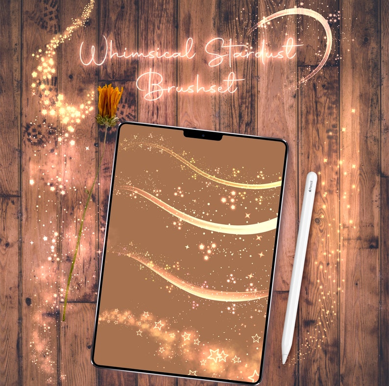 May include: A digital tablet displaying a brown background with gold and white sparkling lines and stars. The text "Whimsical Stardust Brushset" is displayed at the top of the tablet.