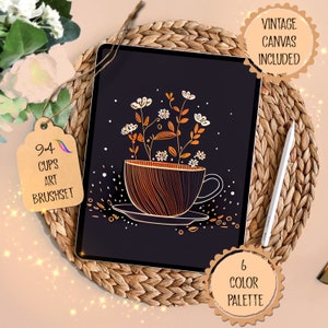 Può includere: Un'illustrazione digitale di una tazza con fiori che crescono al suo interno. La tazza è delineata in oro e ha un motivo a strisce marroni e arancioni. I fiori sono bianchi con centri gialli. Lo sfondo è nero. L'immagine è sullo schermo di un tablet. Il testo "94 Cups Art Brushset" è su un'etichetta marrone. Il testo "6 Color Palette" è su un cerchio marrone. Il testo "Vintage Canvas Included" è su un cerchio marrone.