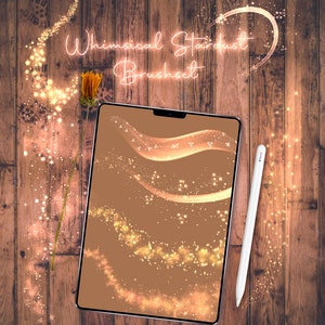 May include: A digital tablet screen displaying a set of whimsical stardust brushes. The brushes are shown on a brown background and feature various shapes and sizes of sparkling gold dust.