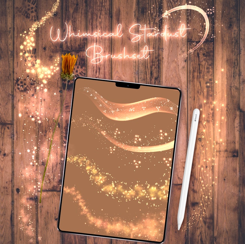 May include: A digital tablet screen displaying a set of whimsical stardust brushes. The brushes are shown on a brown background and feature various shapes and sizes of sparkling gold dust.