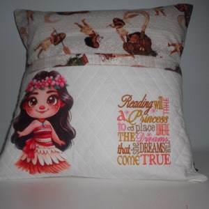 May include: White pillow with a quilted design and a printed image of a cartoon Moana with the text "Reading will take a Princess to a place where the dreams that she dreams come true".