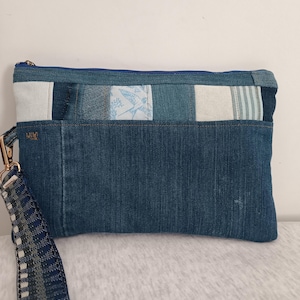 Handgefertigte Denim Clutch: Elegante Patchwork-Tasche. Stilvolles Denim-Modeaccessoire. Geschenkidee für Fashionistas.