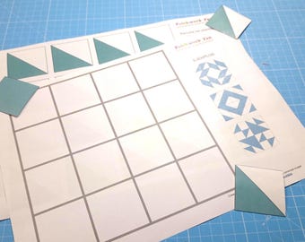 May include: A white sheet of paper with a grid of 18 squares. The paper has the words "Patchwork Fun" and "Patchwork Fun" printed on it. There are several blue paper triangles and squares on the paper.