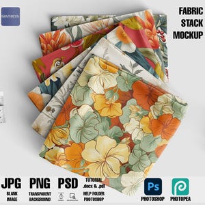 May include: A mockup of a stack of fabric with floral patterns. The fabric is folded and stacked on a white surface. The top fabric has a large floral pattern with yellow, orange, and green flowers. The text "FABRIC STACK MOCKUP" is in the top right corner of the image.