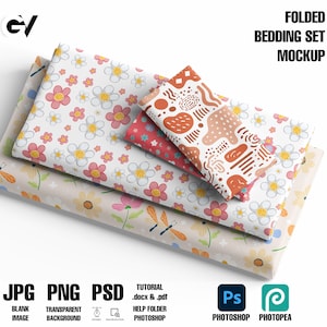 May include: A mockup of a folded bedding set with three different fabric patterns. The top pattern is a white background with red and brown abstract shapes. The middle pattern is a white background with pink flowers. The bottom pattern is a beige background with yellow flowers and orange dragonflies.