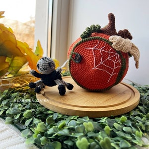 Handcrafted amigurumi spider in a crochet pumpkin house. A creative and eco-friendly crochet decor for Halloween. Digital pattern available for download.
