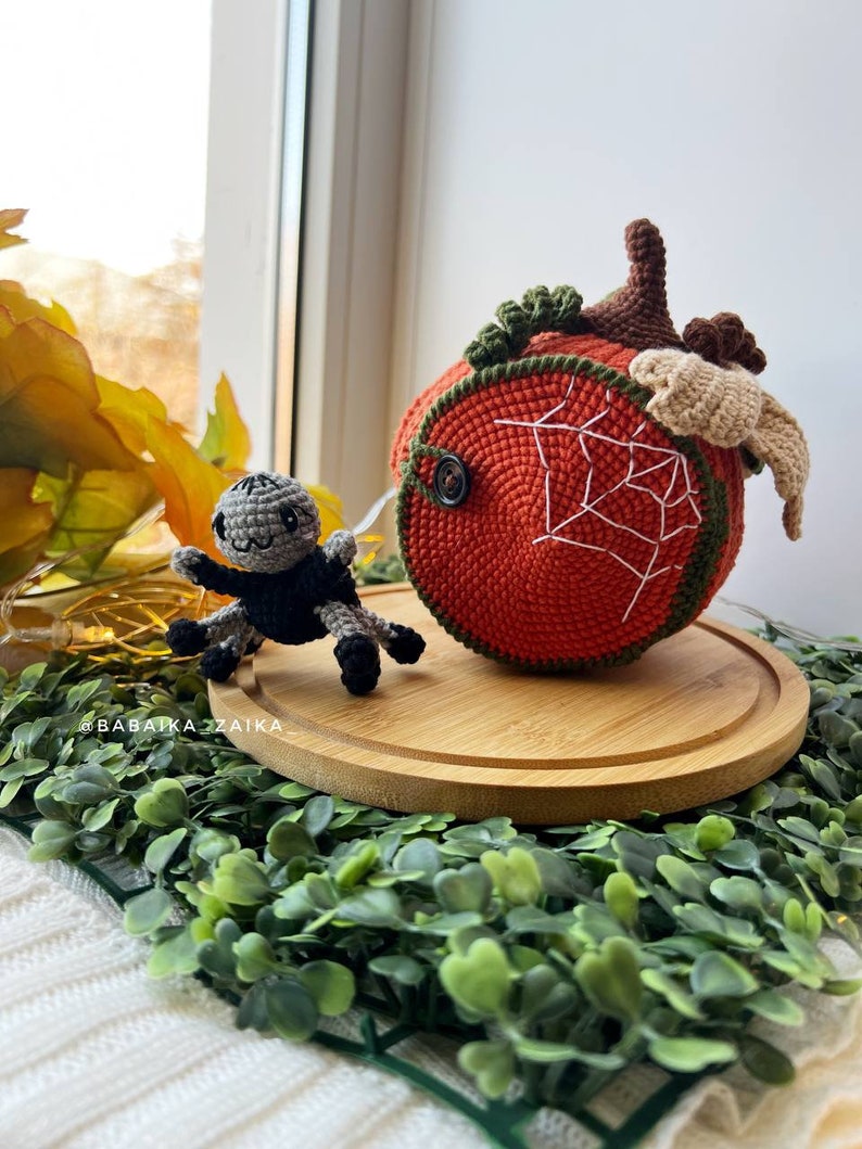 Handcrafted amigurumi spider in a crochet pumpkin house. A creative and eco-friendly crochet decor for Halloween. Digital pattern available for download.