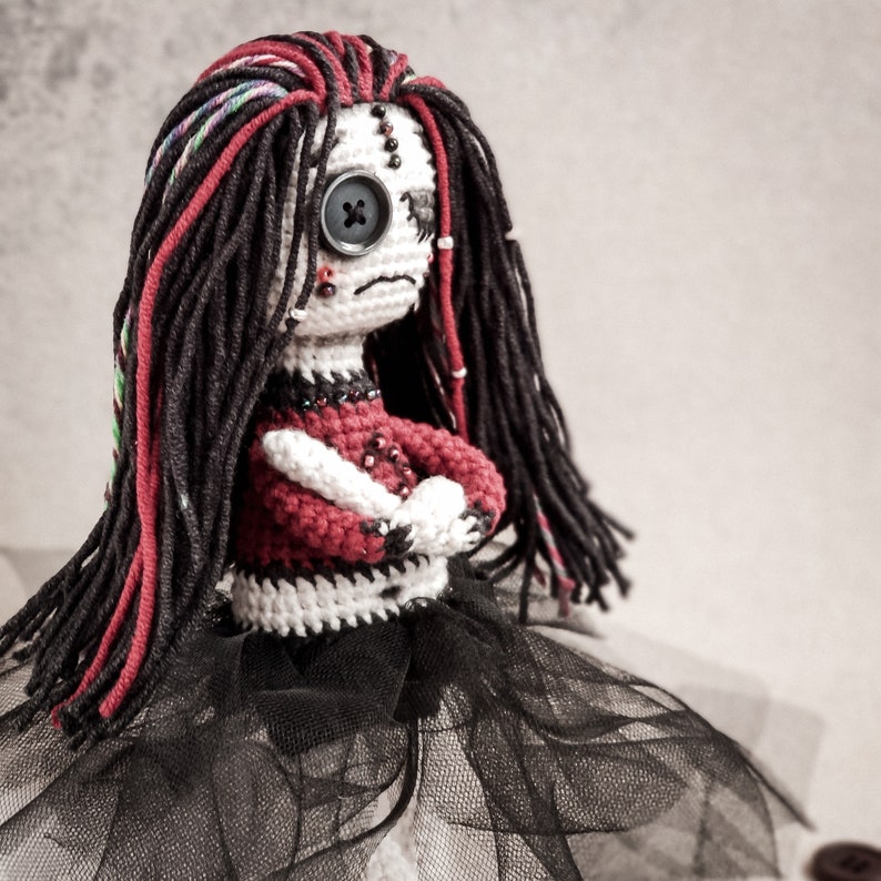 Unique Halloween crochet doll, featuring dark-themed amigurumi design, with black and red accents, giving a spooky and gothic vibe.