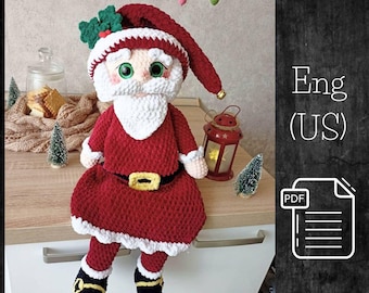 Pode incluir: Padrão de crochê para um boneco de Papai Noel. O boneco está vestindo um terno vermelho e branco com barba branca e um chapéu preto. O padrão está disponível em inglês (EUA) e está em formato PDF.