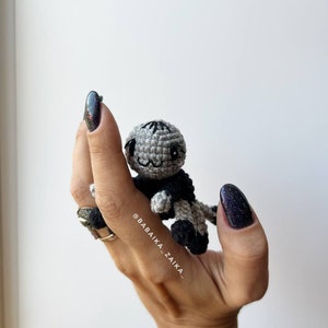 Close-up of a handmade amigurumi spider from our crochet pattern. Perfect as an eco-friendly Halloween ornament or DIY gift idea.