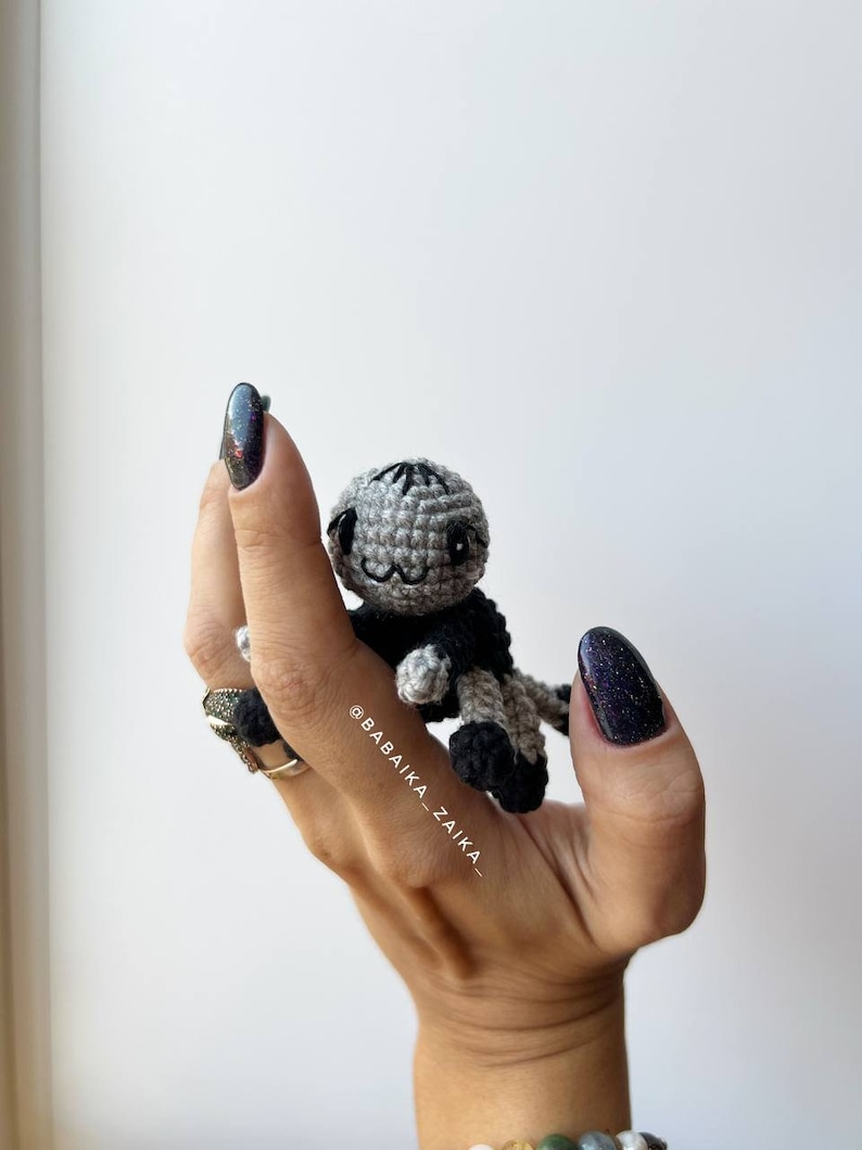 Close-up of a handmade amigurumi spider from our crochet pattern. Perfect as an eco-friendly Halloween ornament or DIY gift idea.