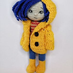 A side-by-side image of the Coraline doll and the voodoo bunny, illustrating the size comparison between the two handmade crochet toys.